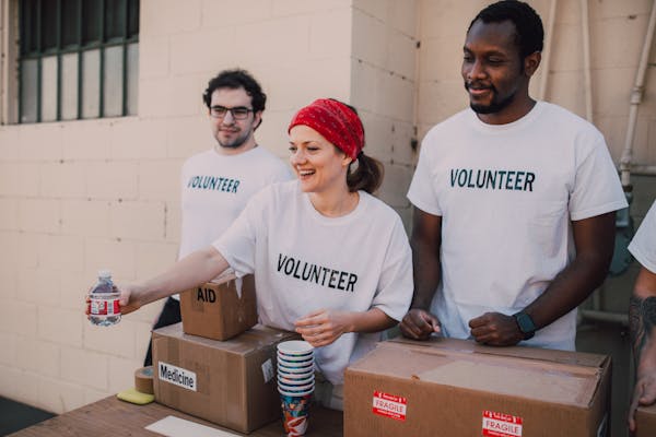 Volunteers serving meals